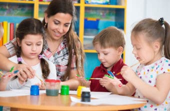An early childhood teacher with children