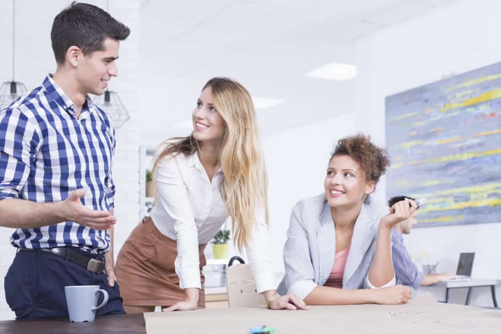 Group of Young People Talking About Business