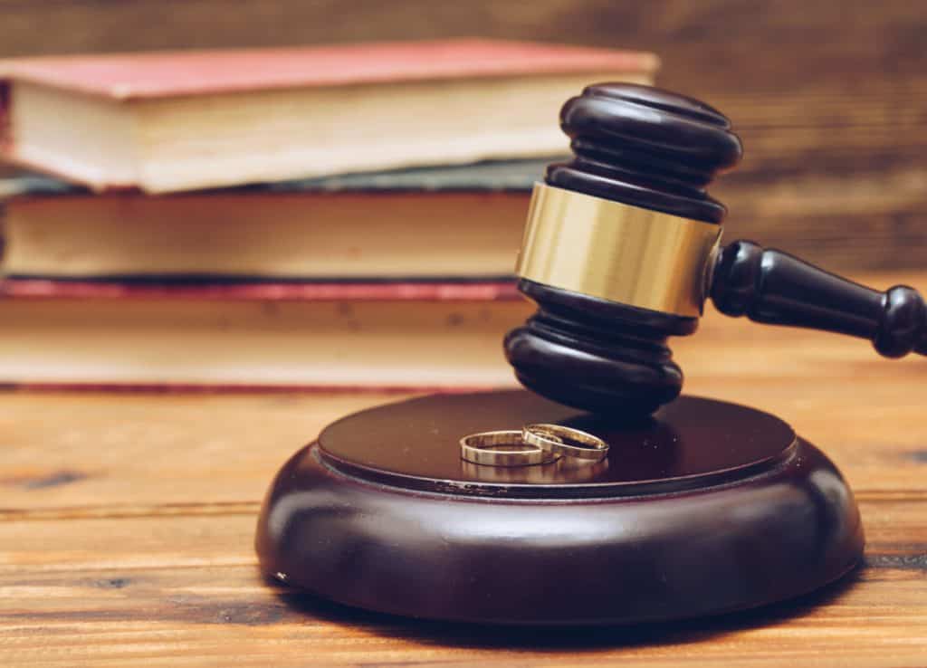 Wooden Judge Gavel and Golden Rings