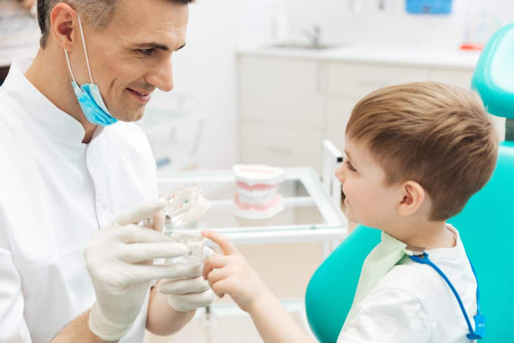 Child smiling at dentist